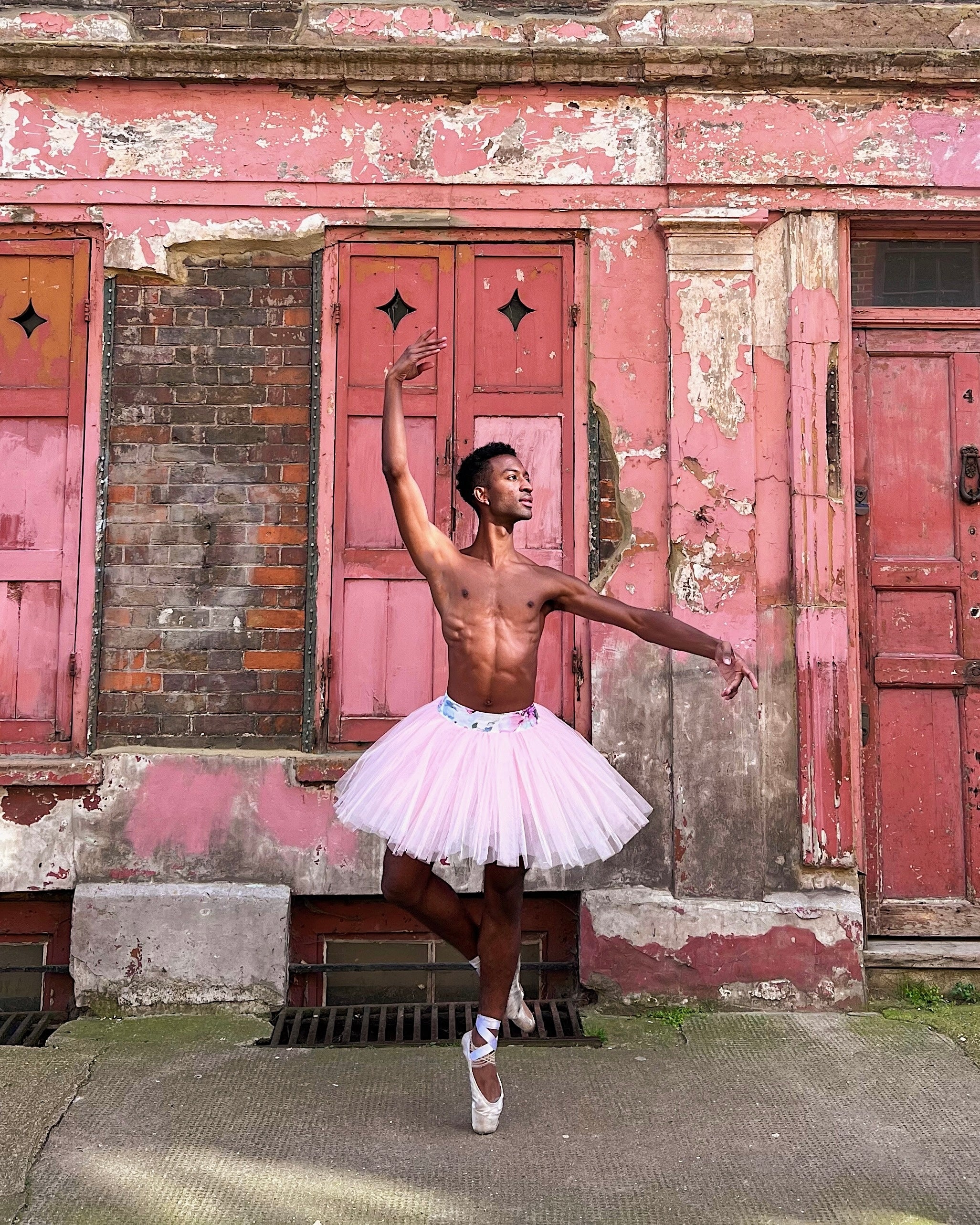 Ballet Photographed In Front Of A Pink Wall