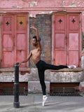 Ballet In Tights In Front Of A Pink Wall