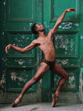 Ballet Photographed In Front Of A Green Door